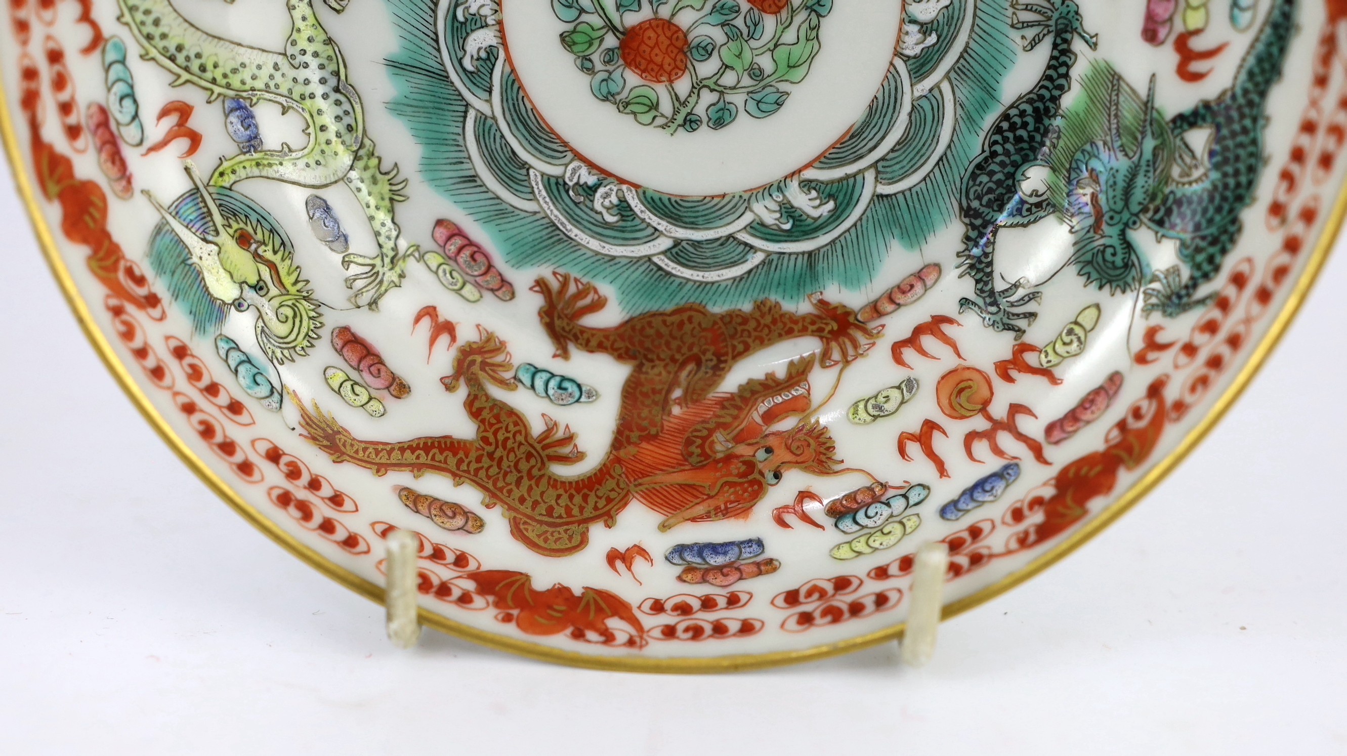 A Chinese famille rose fencai ‘dragon’ saucer dish, Jiaqing four character seal mark, 19th century, 14.6cm diameter